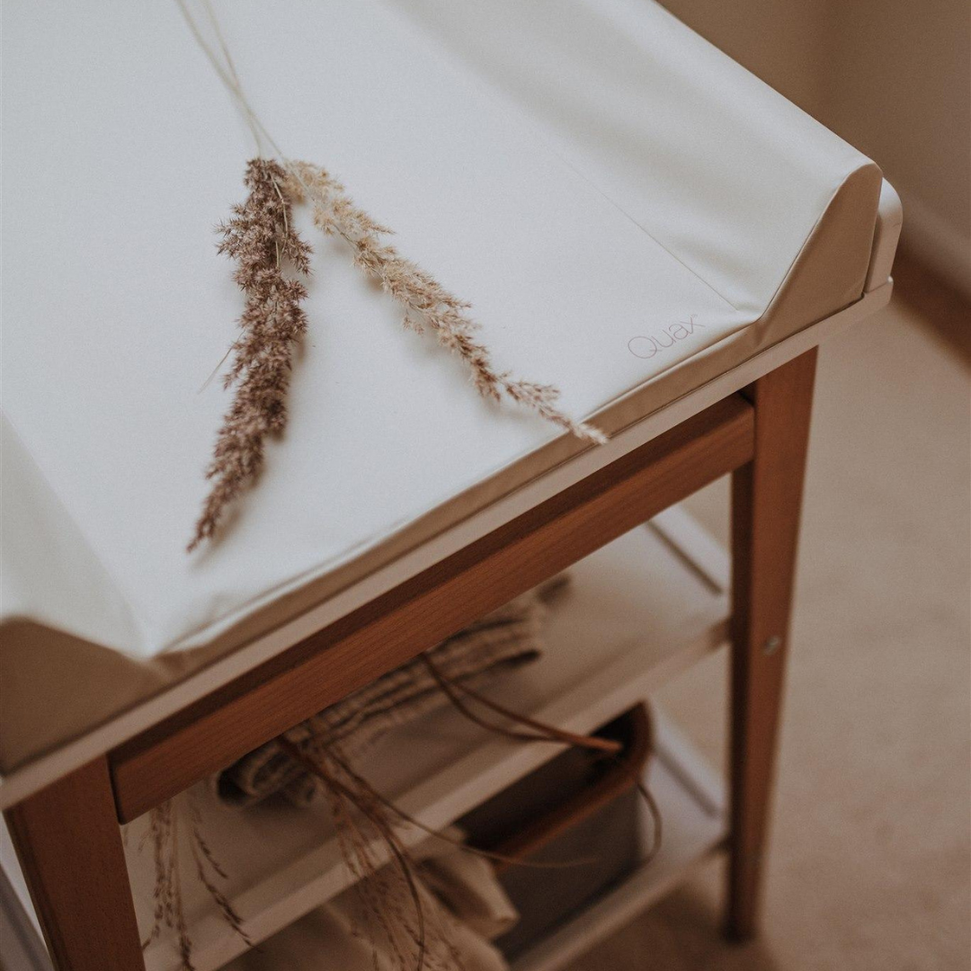 close up of quax changing pad clay on changing table in modern nursery