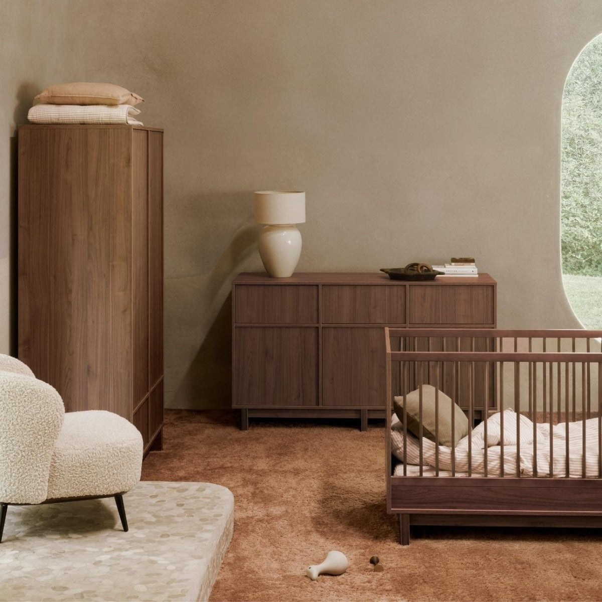 Quax Kyo Walnut dark wood convertible cot bed in modern neutral nursery