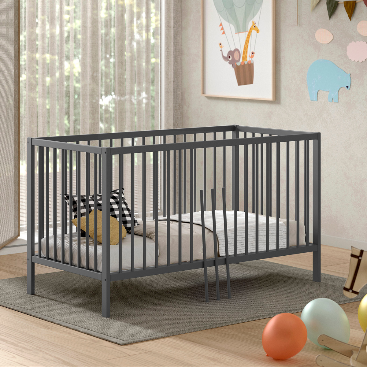 Modern grey coloured wooden 140x70cm cot bed in a modern nursery baby bedroom. FSC certified European beech wooden baby cot. Modern design sturdy looking well built baby cot bed