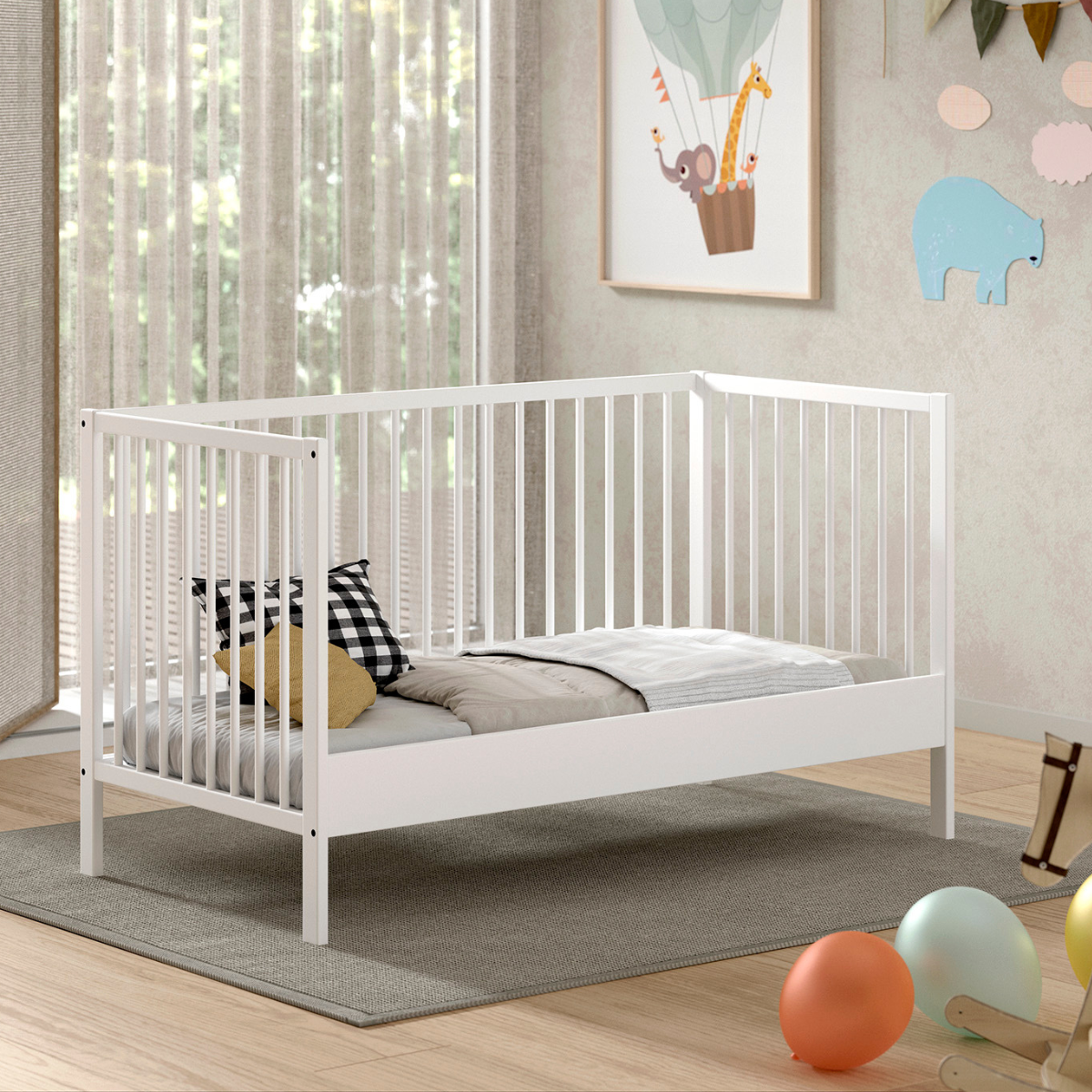 VIPACK JAXX Modern white coloured wooden 140x70cm cot bed in a modern nursery baby bedroom. FSC certified European beech wooden baby cot. Modern design sturdy looking well built white baby cot bed showing day bed mode. One side of cot removed to be left open to use as Montessori day bed for toddler. IKEA style scandi cot bed
