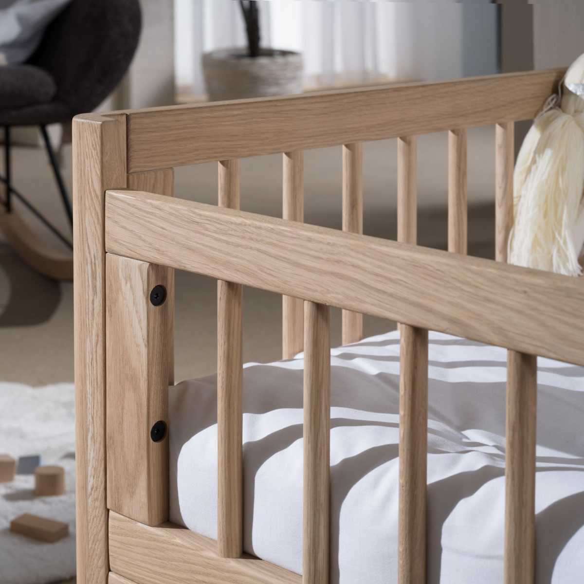 wooden oak toddler bed close up of strong well made wooden bed rails showing wood grain