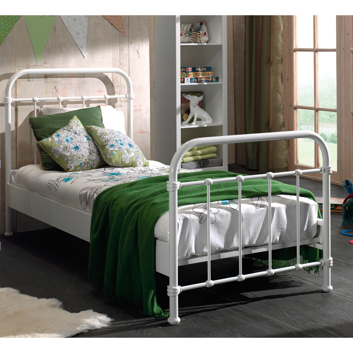 Kids White metal single bed with green bedding in a bedroom setting. Modern strong and sturdy well made looking bed