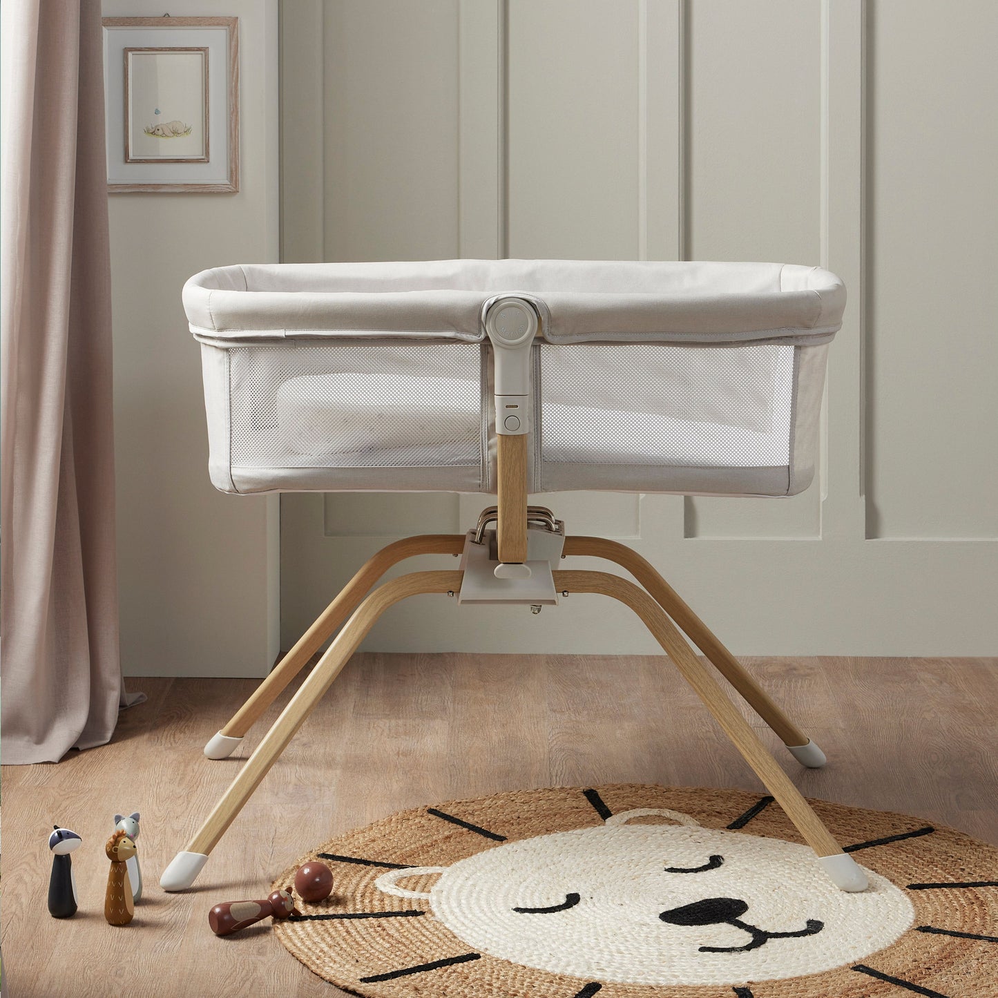 side view of Babymore Air Motion Gliding Crib grey with a breathable mesh sides in nursery 
