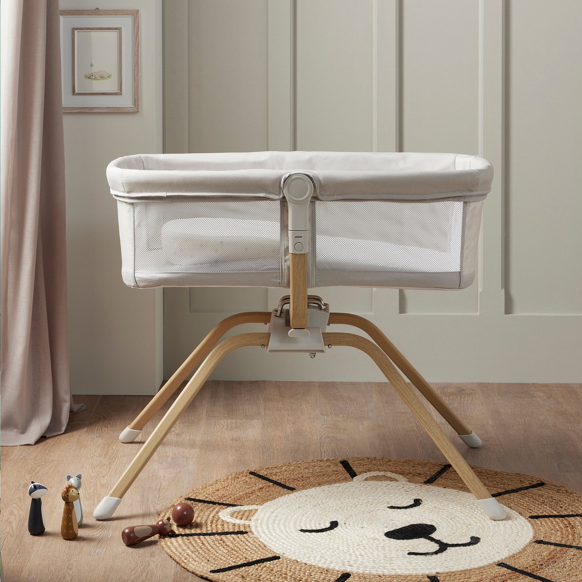 side view of Babymore Air Motion Gliding Crib grey with a breathable mesh sides in nursery 