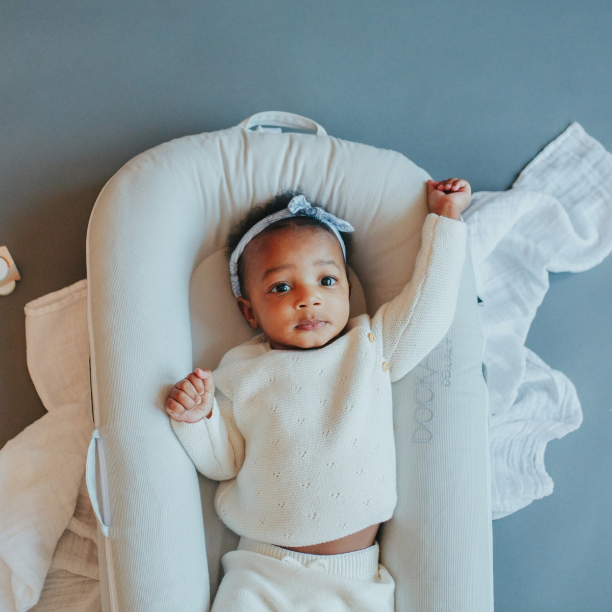 ockATot Deluxe+ Cloud Grey baby dock for supervised lounging, tummy time and play.