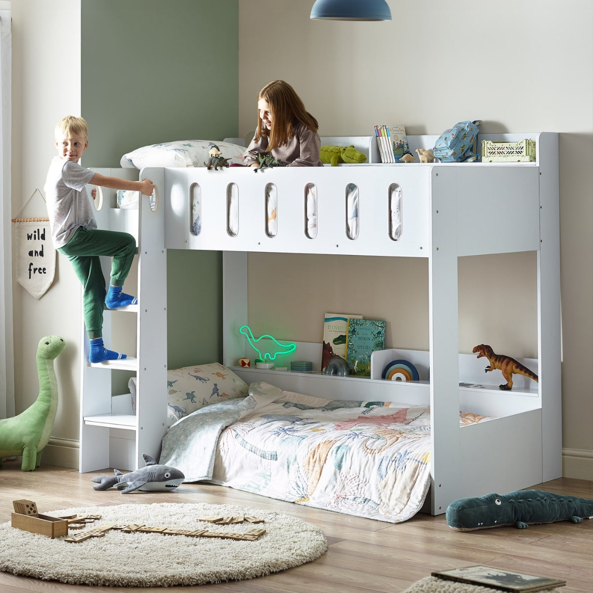 two children playing on a Julian Bown white vision bunk bed in room with toys