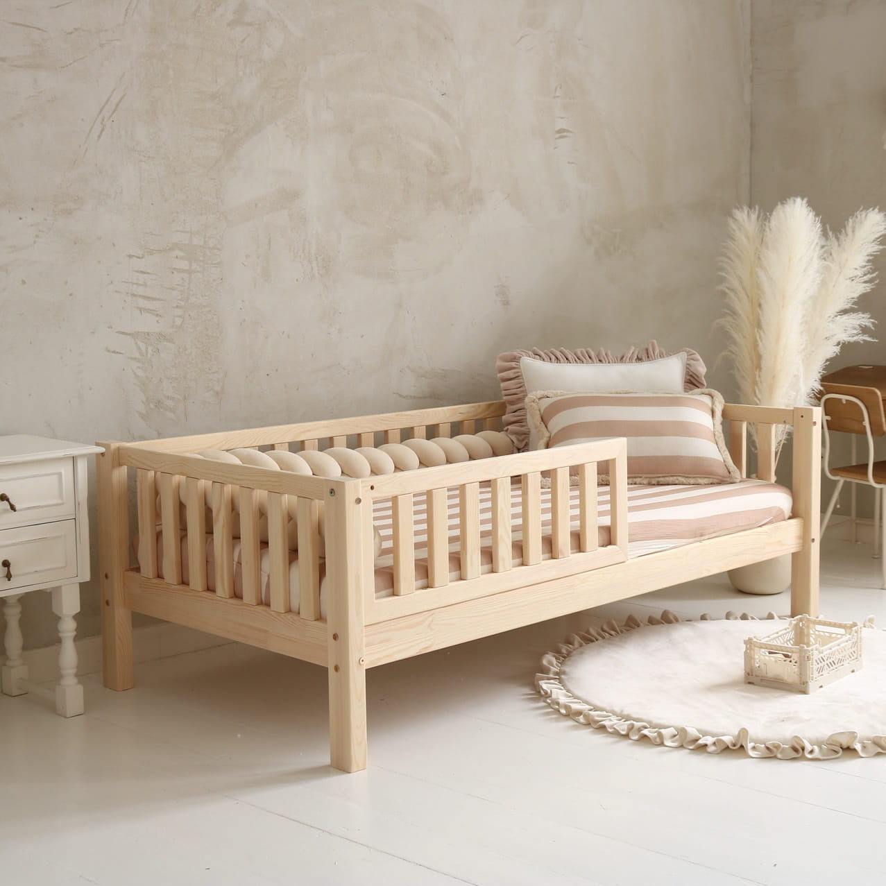 Luletto cubbly natural wood toddler bed with guard rail in european bedroom
