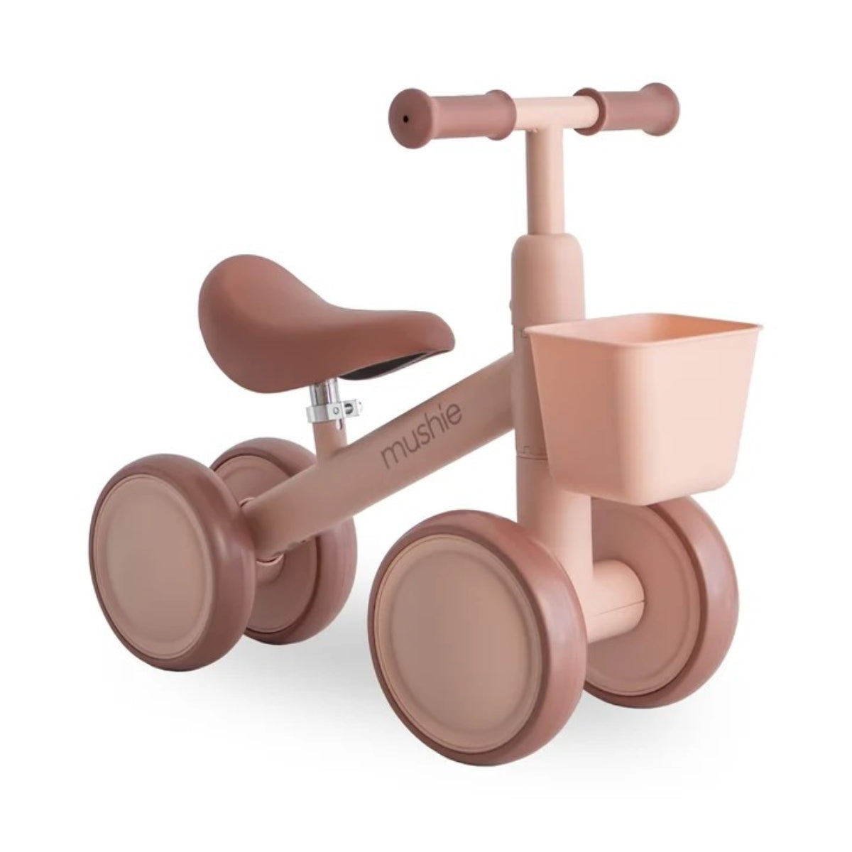 Mushie Mini Toddler Bike in Blush with EVA wheels, adjustable padded seat and detachable front basket on white background