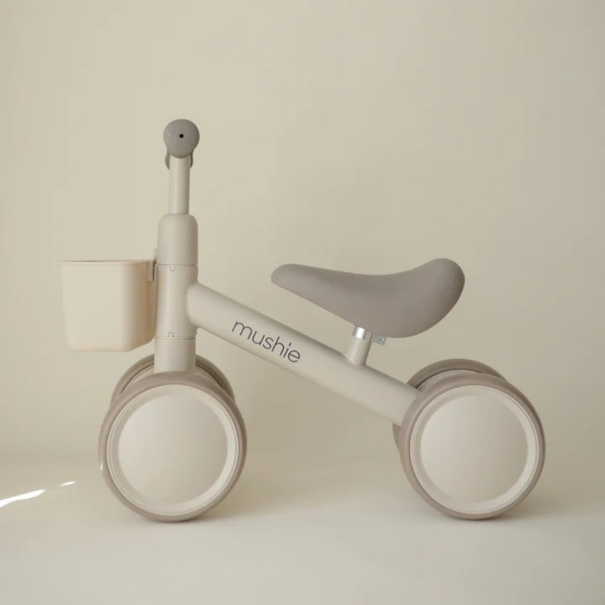 Mushie Mini Toddler Bike in Shifting Sand side view 