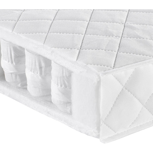 120 x 60cm pocket sprung mattress cut out showing soft springs inside on plain white background