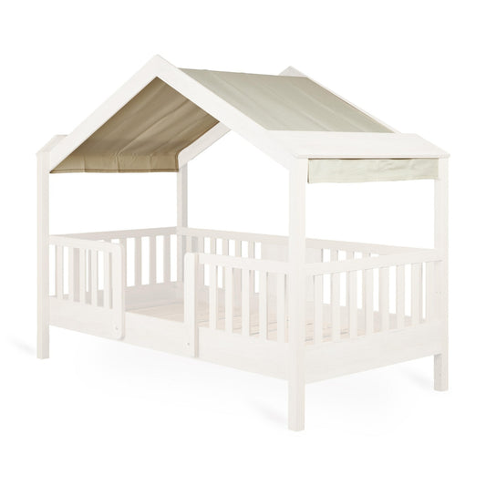 Quax Chalet Junior Bed Butter fabric roof cover on natural wood house bed that has been faded out
