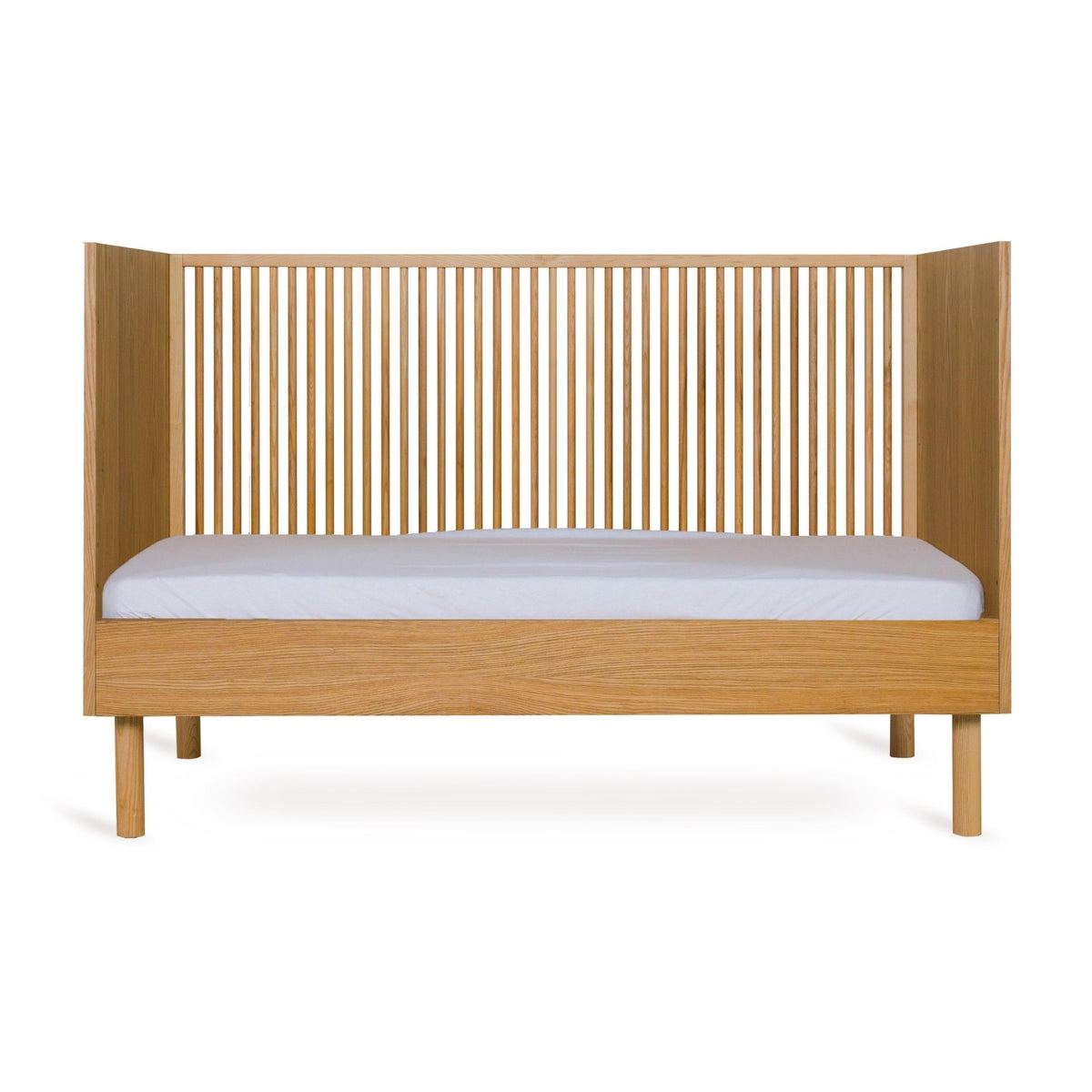Quax Hai No Ki 140 x 70cm convertible cot bed in Natural Ash with open side as toddler bed without mattress on white background