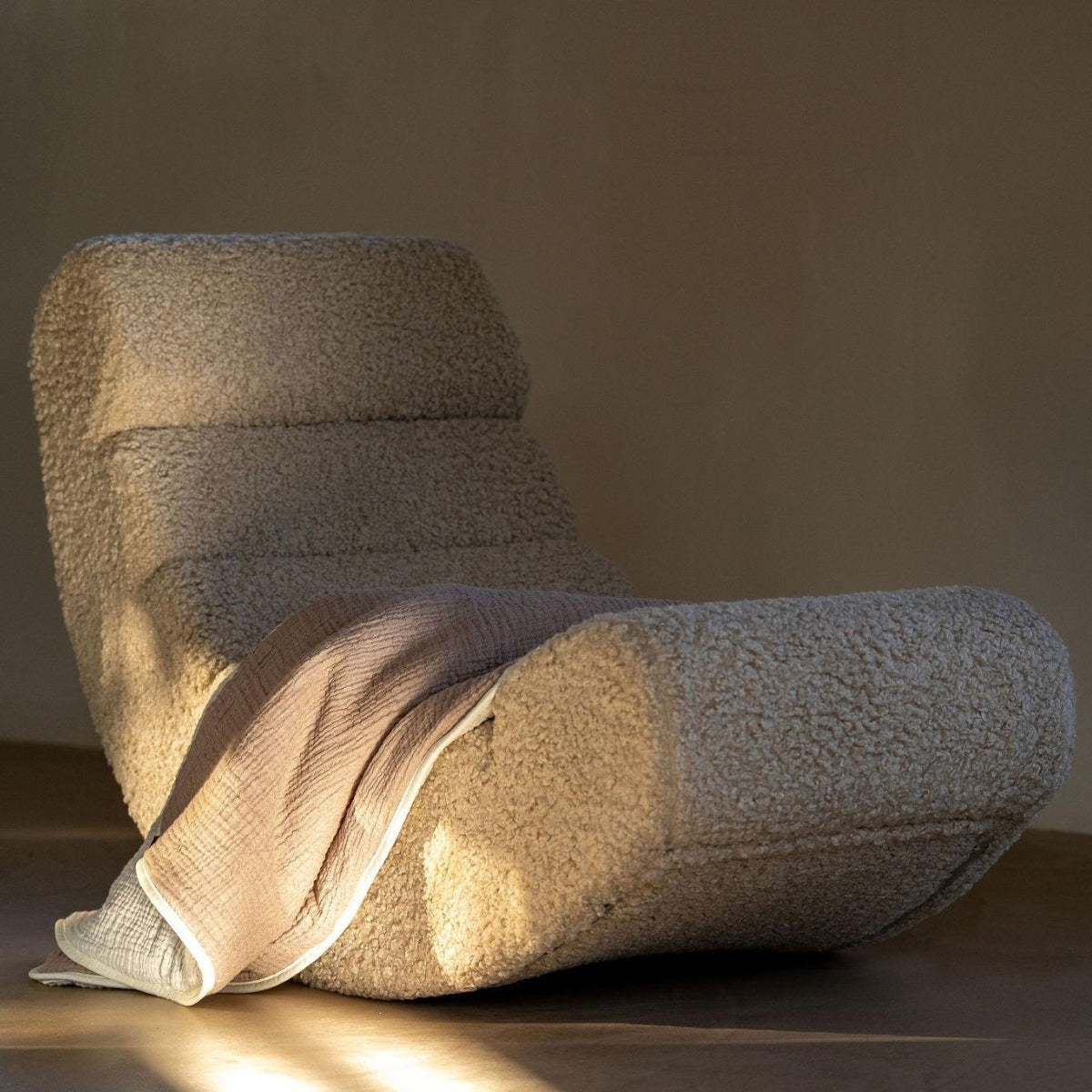 Quax Rocking Banana Sheep upholstered rocking chair in contemporary living area with neutral decor