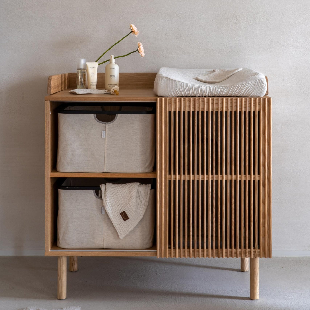 Quax Beige-Natural storage basket fitted inside Hai No Ki chest with baby changing pad on in japandi inspired nursery