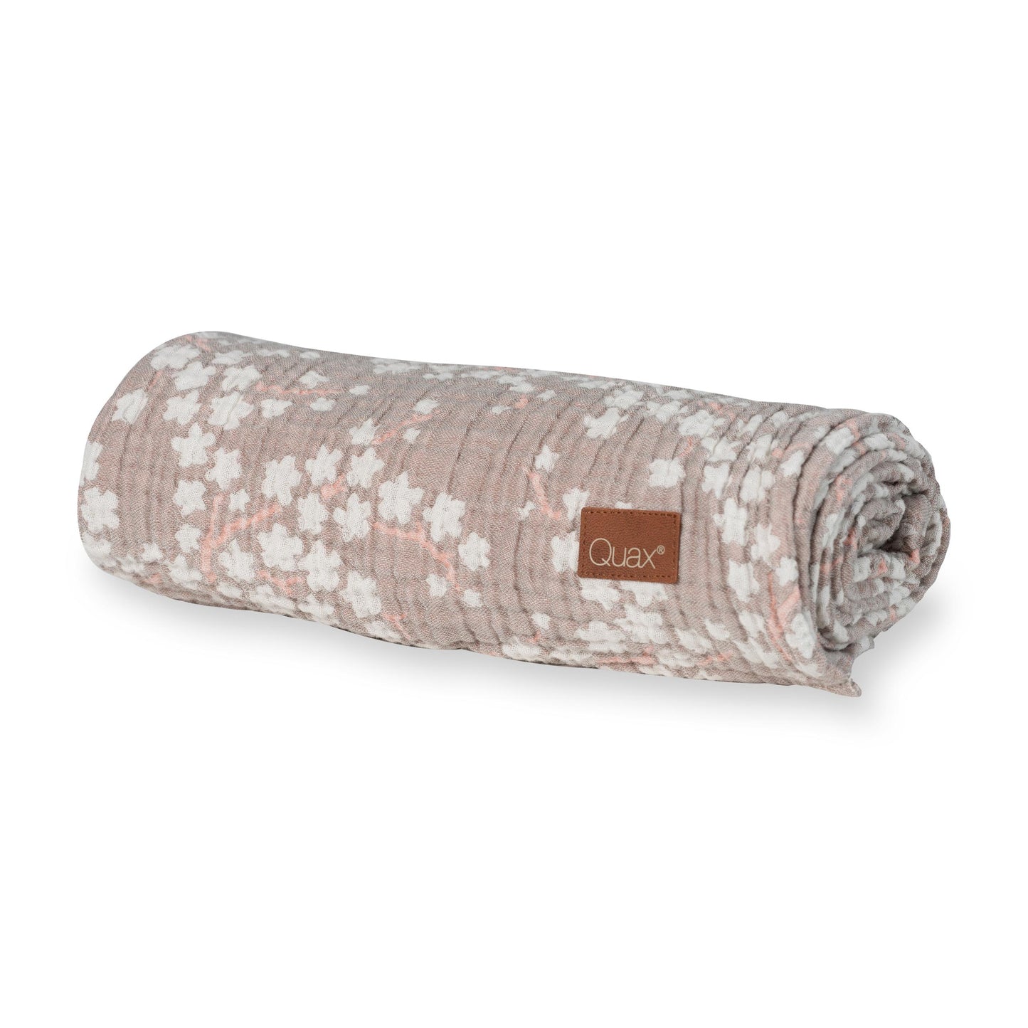 rolled up Quax XL muslin baby blanket swaddle with blossom flower print on plain white background