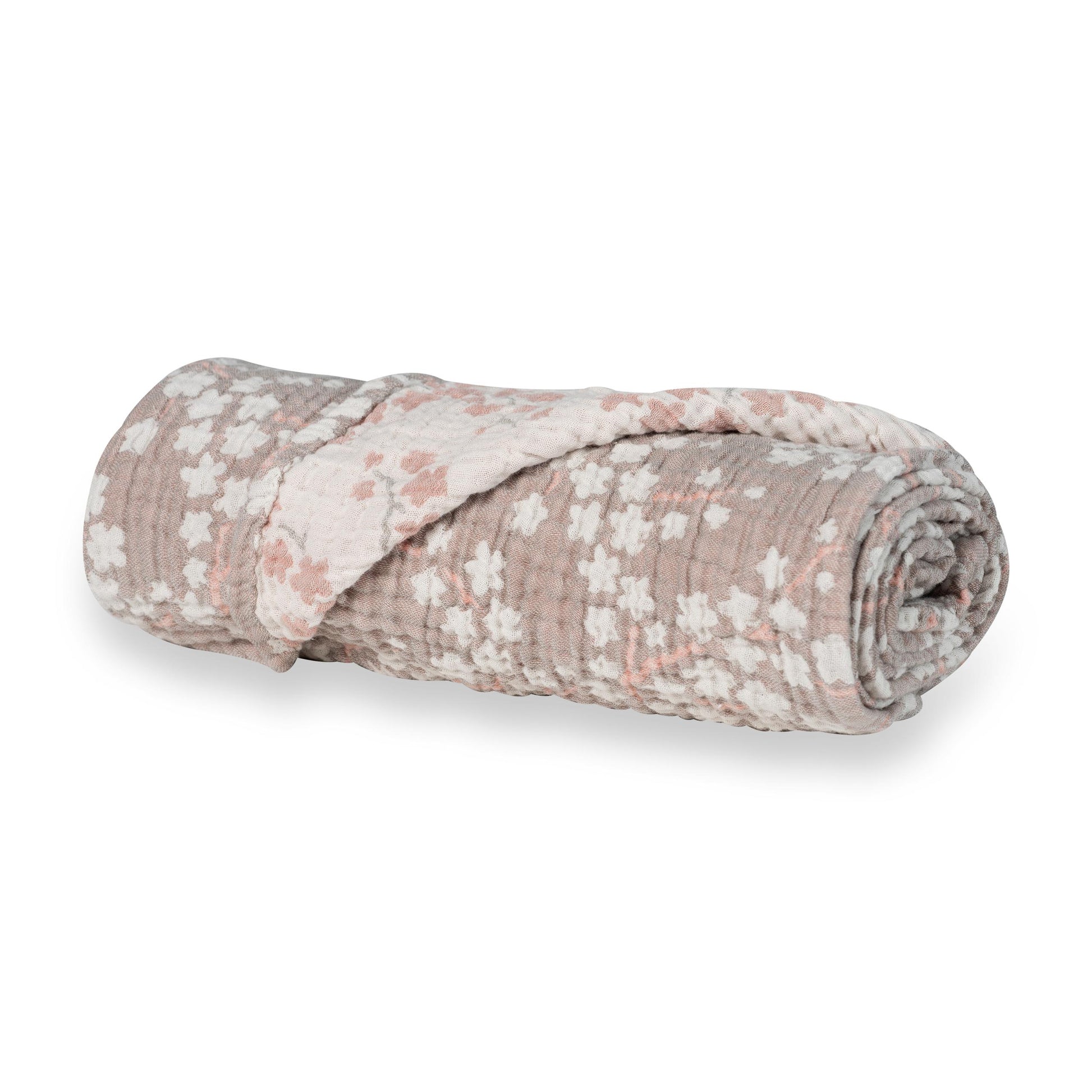 rolled up Quax XL muslin baby blanket 100% cotton with blossom floral pattern on plain white background