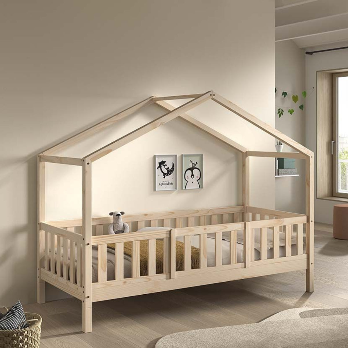 house shaped children's bed with bed guard made from natural wood in modern European nursery bedroom