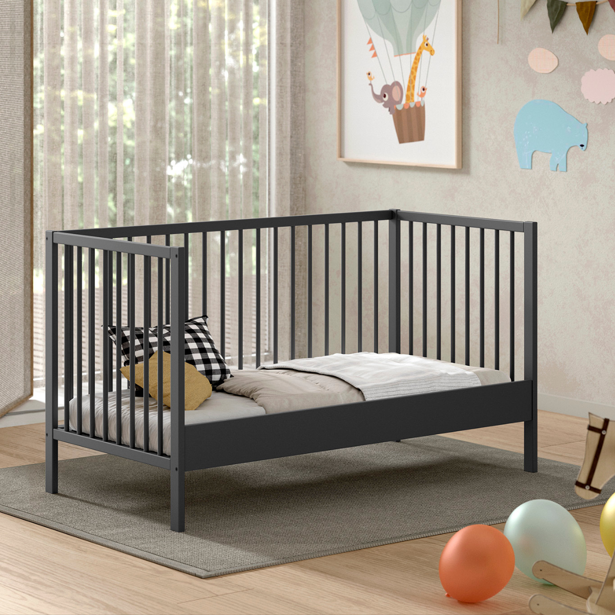 VIPACK JAXX Modern grey coloured wooden 140x70cm cot bed in a modern nursery baby bedroom. FSC certified European beech wooden baby cot. Modern design sturdy looking well built baby cot bed showing day bed mode. One side of cot removed to be left open to use as Montessori day bed for toddler. IKEA modern scandi looking cot bed 
