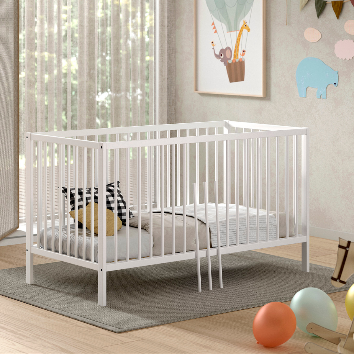 Modern white coloured wooden 140x70cm cot bed in a modern nursery baby bedroom. FSC certified European beech wooden baby cot. Modern design sturdy looking well built white IKEA Scandi style baby cot bed 