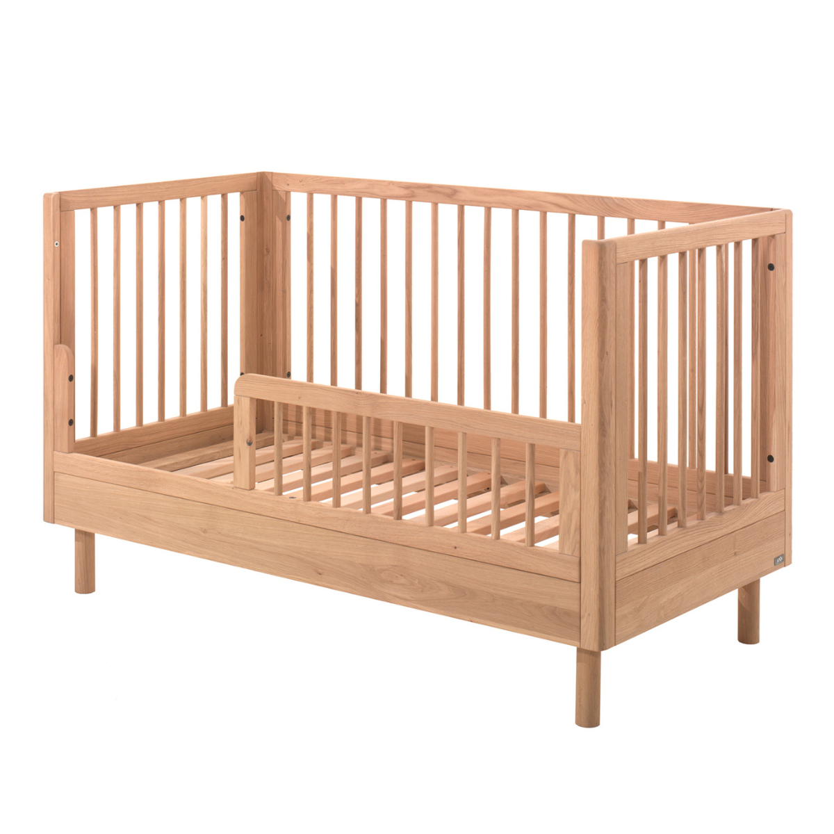 VIPACK JAXX FORREST solid oak cot bed with open side being used as a toddler bed with toddler bed guard rail with slatted wooden base 140x70cm  on plain white background
