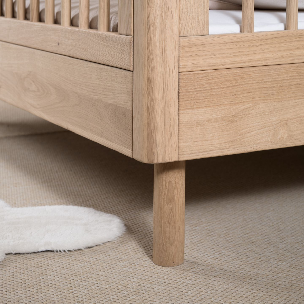 wooden oak toddler bed close up image of sturdy looking high quality real wood bed panels showing wood grain
