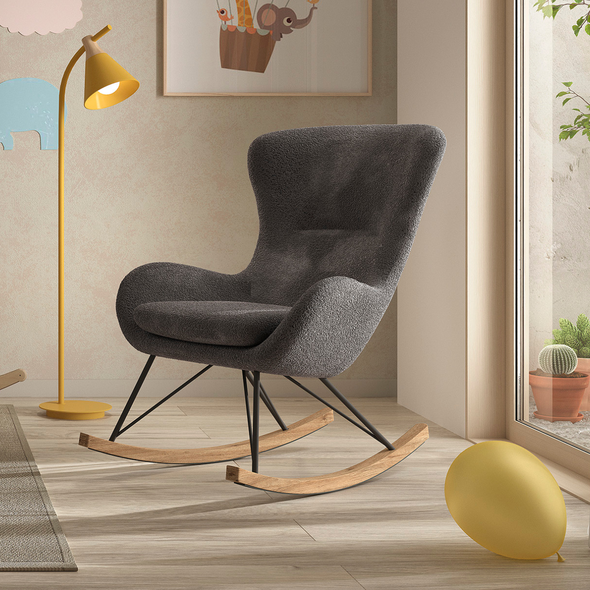 grey rocking nursing chair with boucle fabric in a modern scandi nursery