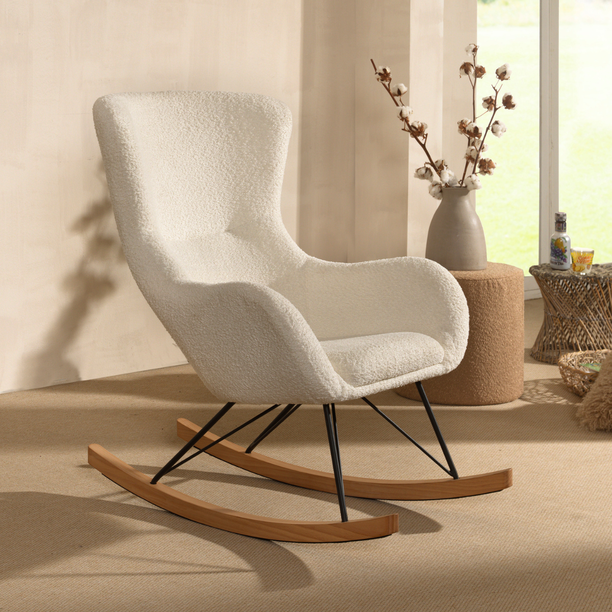 comfy and relaxing nursing chair in soft white fabric in modern scandi nursery room