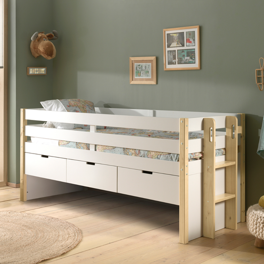 White and natural wooden kids mid sleeper cabin bed in a room with green walls. The bed has three underbed storage drawers and a wooden ladder.