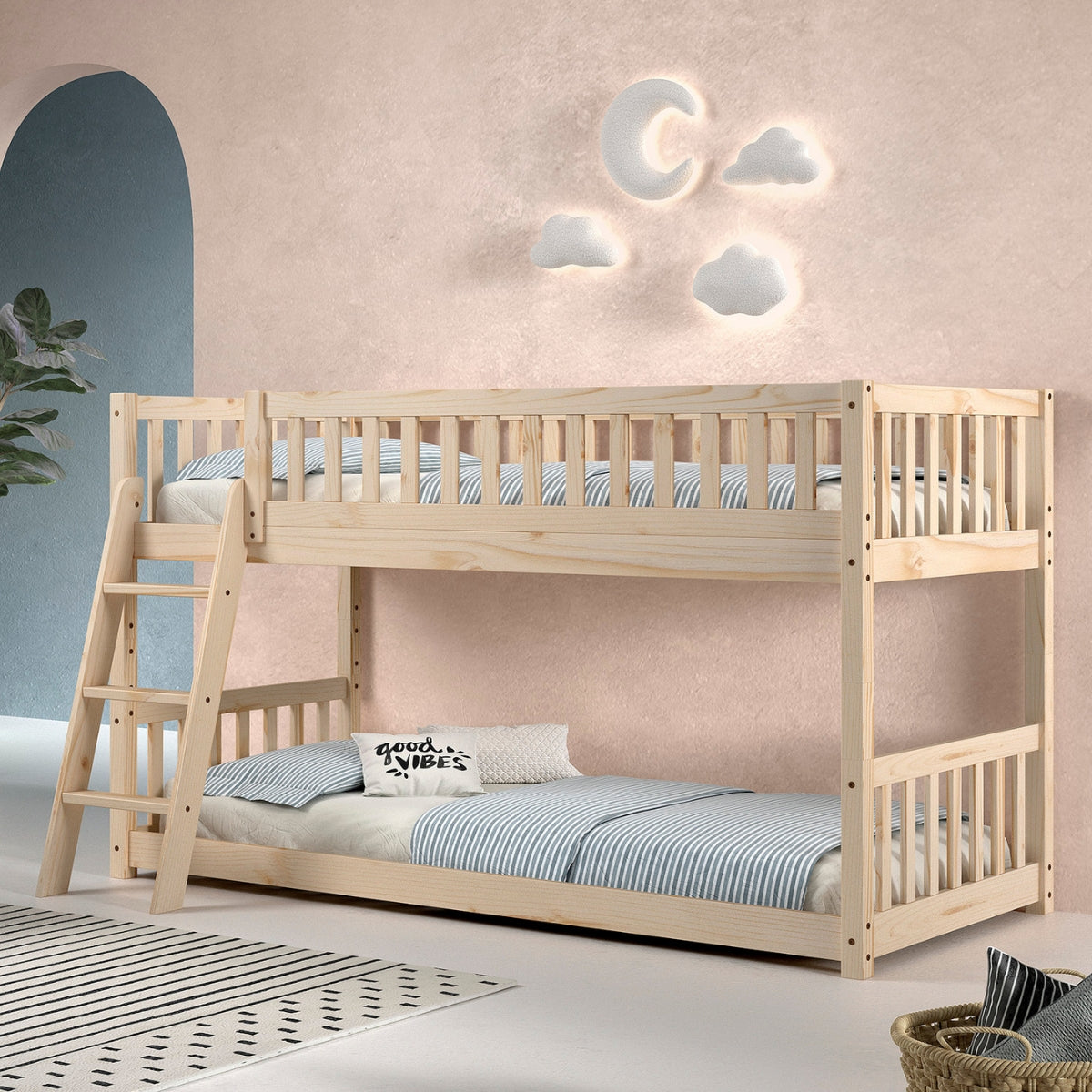natural light coloured pine wood kids bunk bed with solid wooden ladder and low Montessori bottom bunk in kids European design inspired bedroom