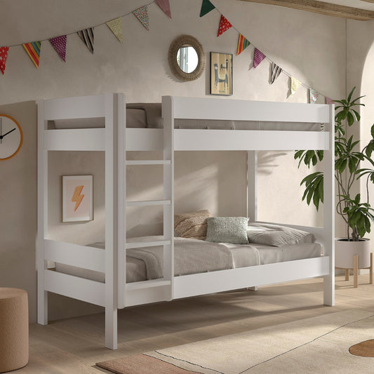 White VIPACK PRIMO wooden bunk bed with an integrated ladder, styled in a child's bedroom with colorful bunting
