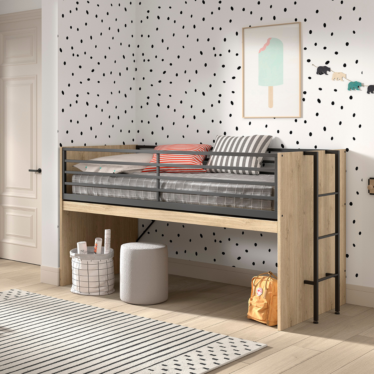 A modern children’s bedroom featuring a VIPACK SAM mid sleeper cabin bed that has an extendable wooden desk underneath that has been folded away. The space underneath the bed is being as a space to store items. The bed has a natural wood finish with black metal railings and ladder. 