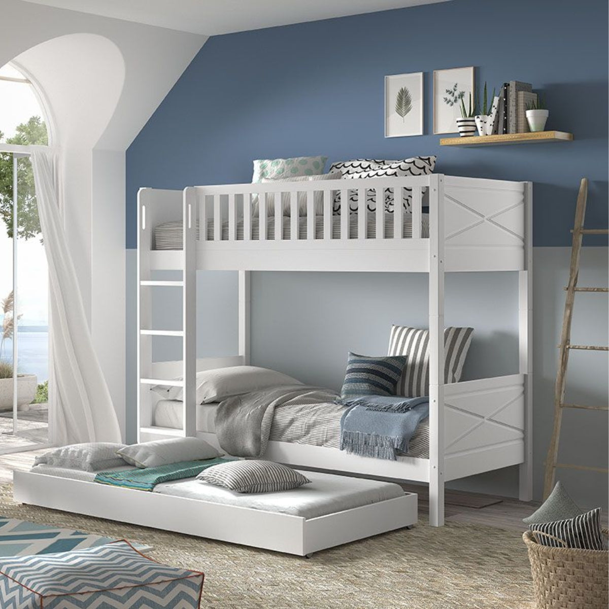 White bunk bed with pull-out trundle in a room with blue walls and large windows.