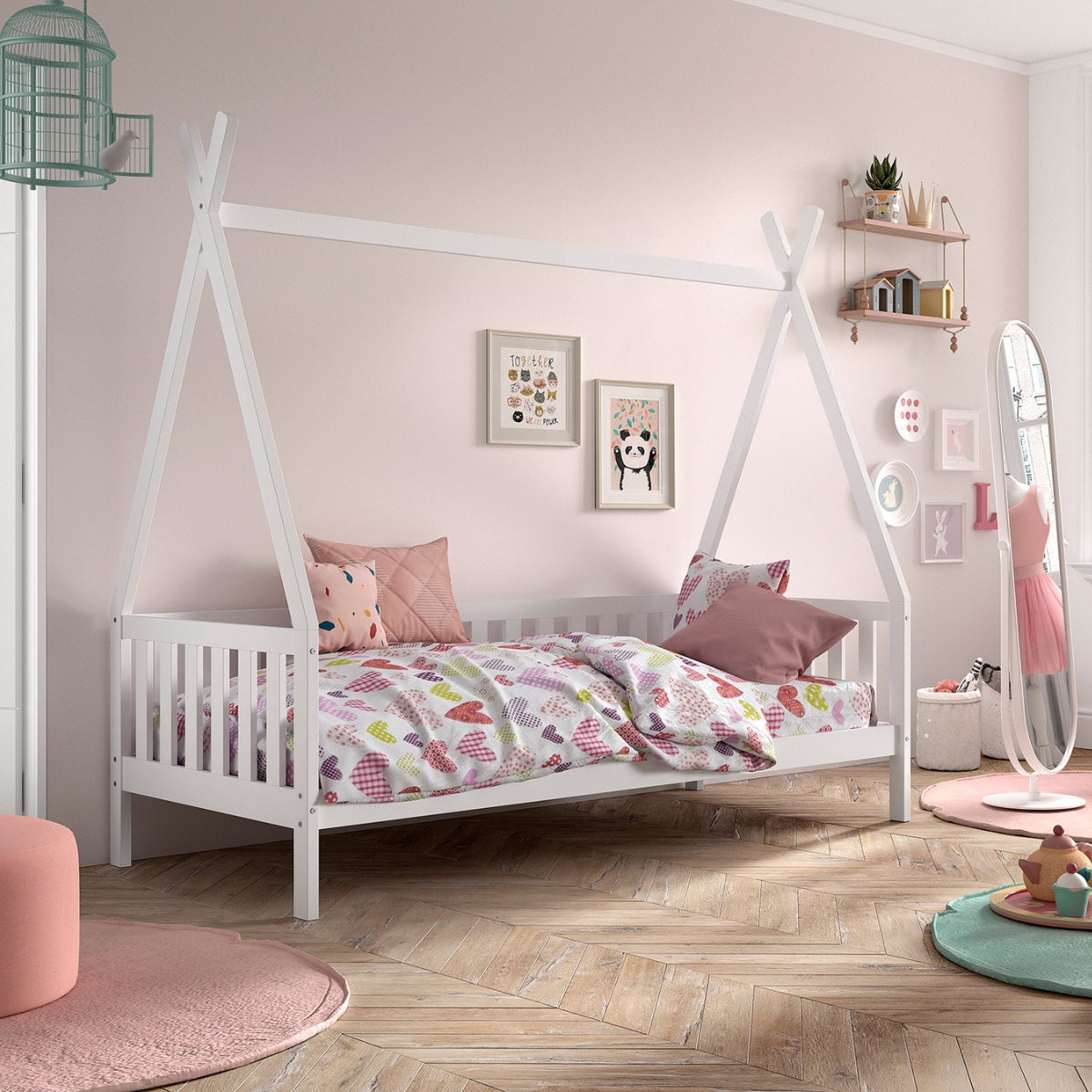 white wooden teepee bed in girls bedroom with pink cushions and a duvet