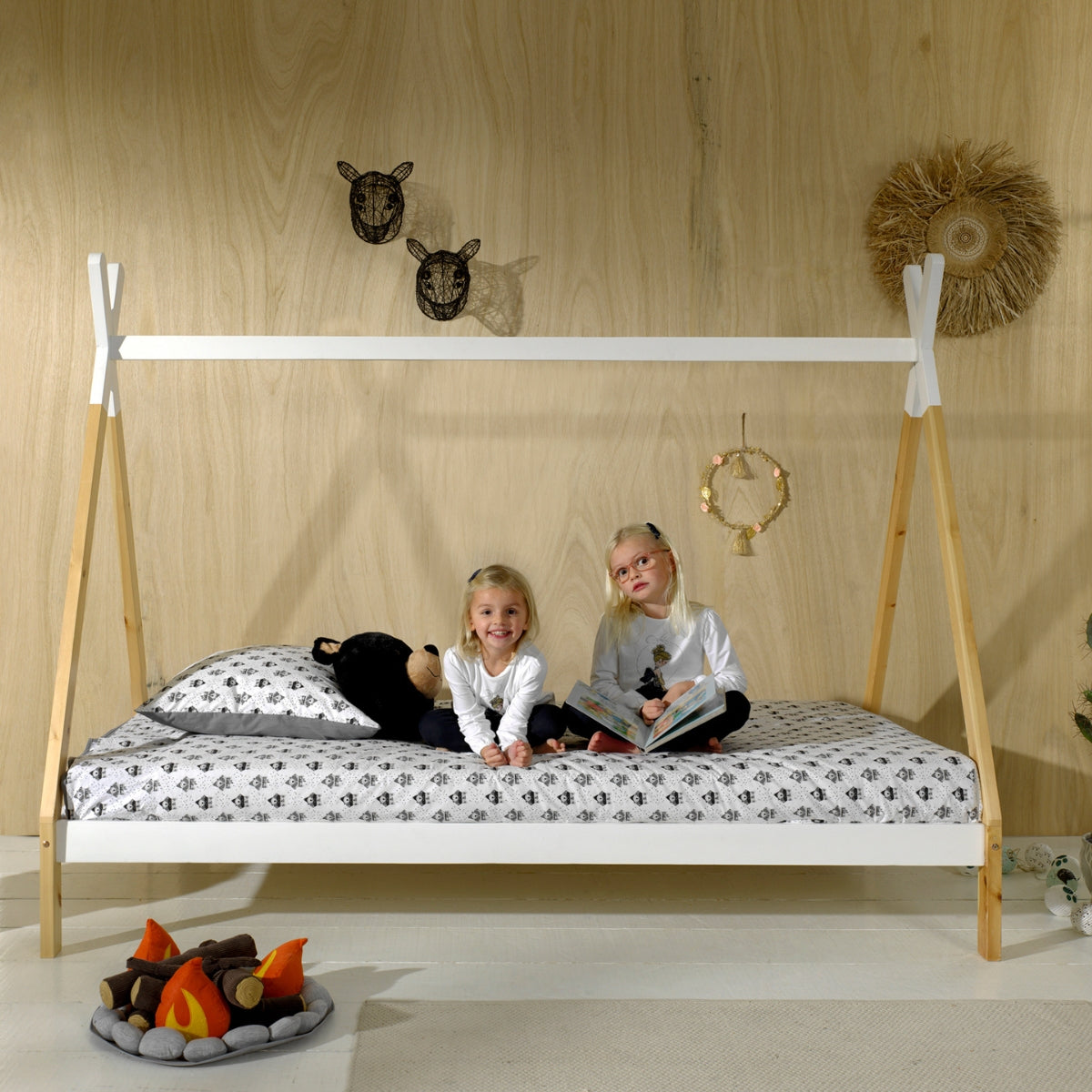 two children sat on a VIPACK raised teepee bed in modern bedroom