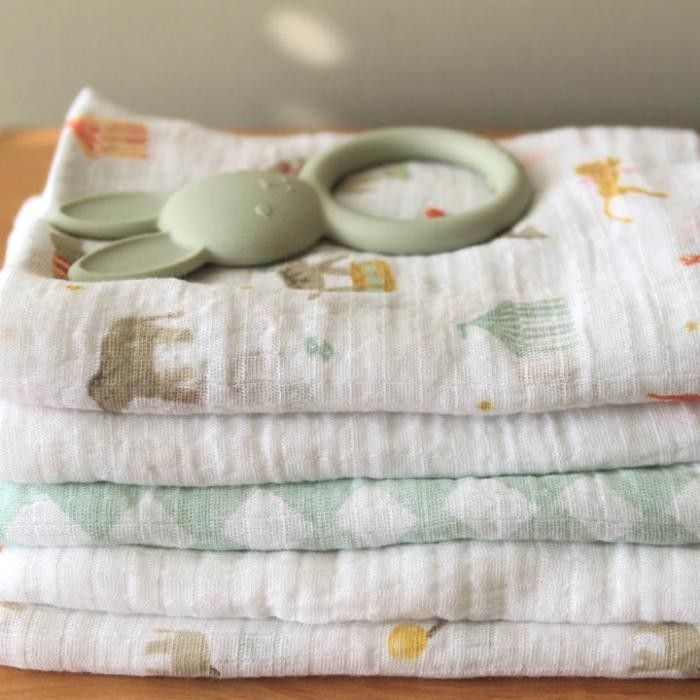 close up of aden + anais Soft breathable 100% cotton muslin squares in the Elephant Circus print 