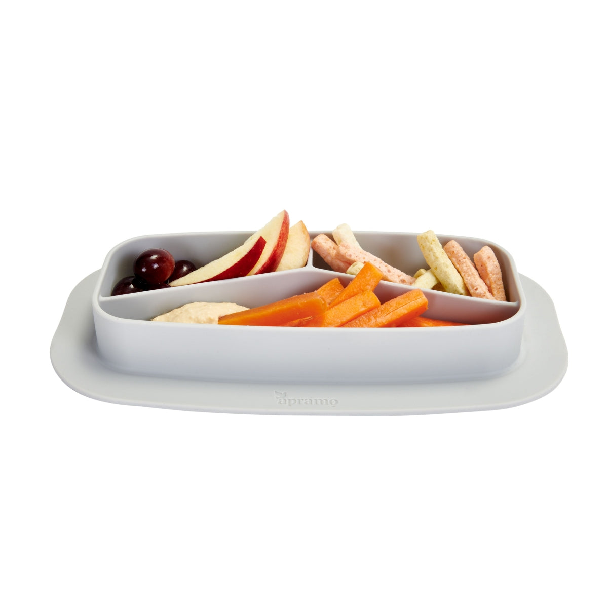 Divided silicone toddler plate with fruits in different compartments on white background