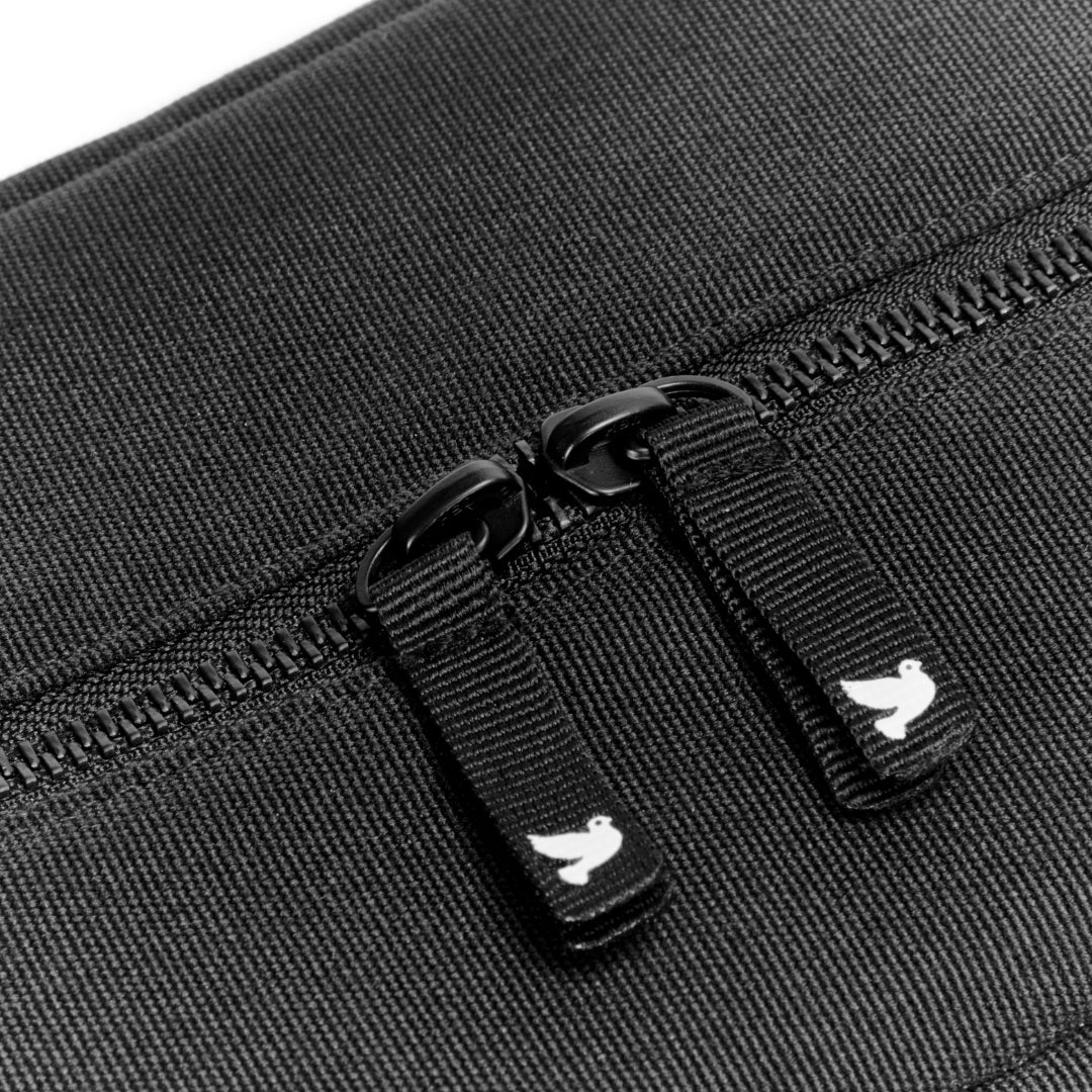 close up of apramo logo on zip of black stroller organiser