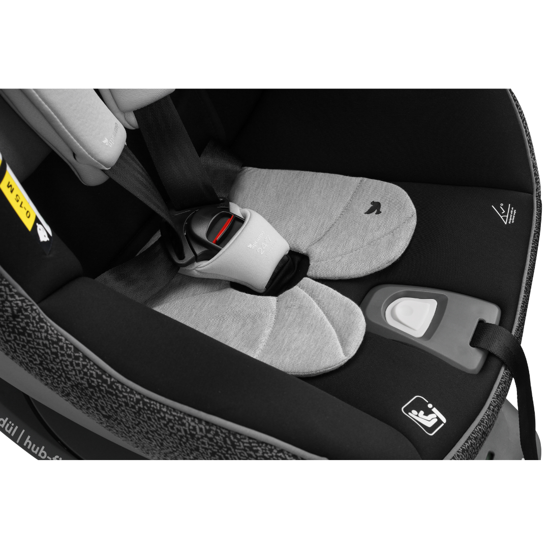 close up of black waterproof pee protector being used in infant car seat