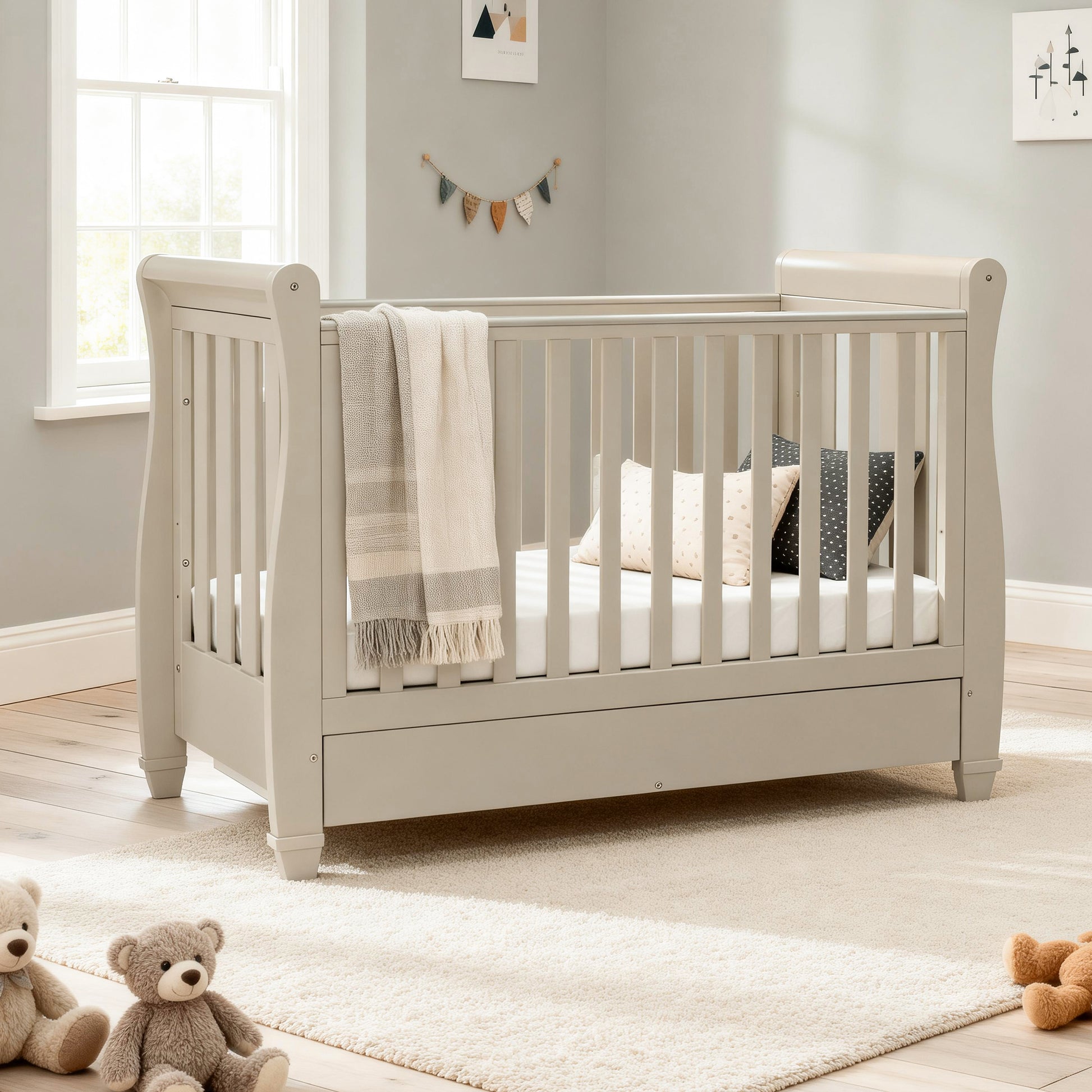 babymore Eva dropside sleigh cot bed cashmere with underbed drawer in baby nursery 
