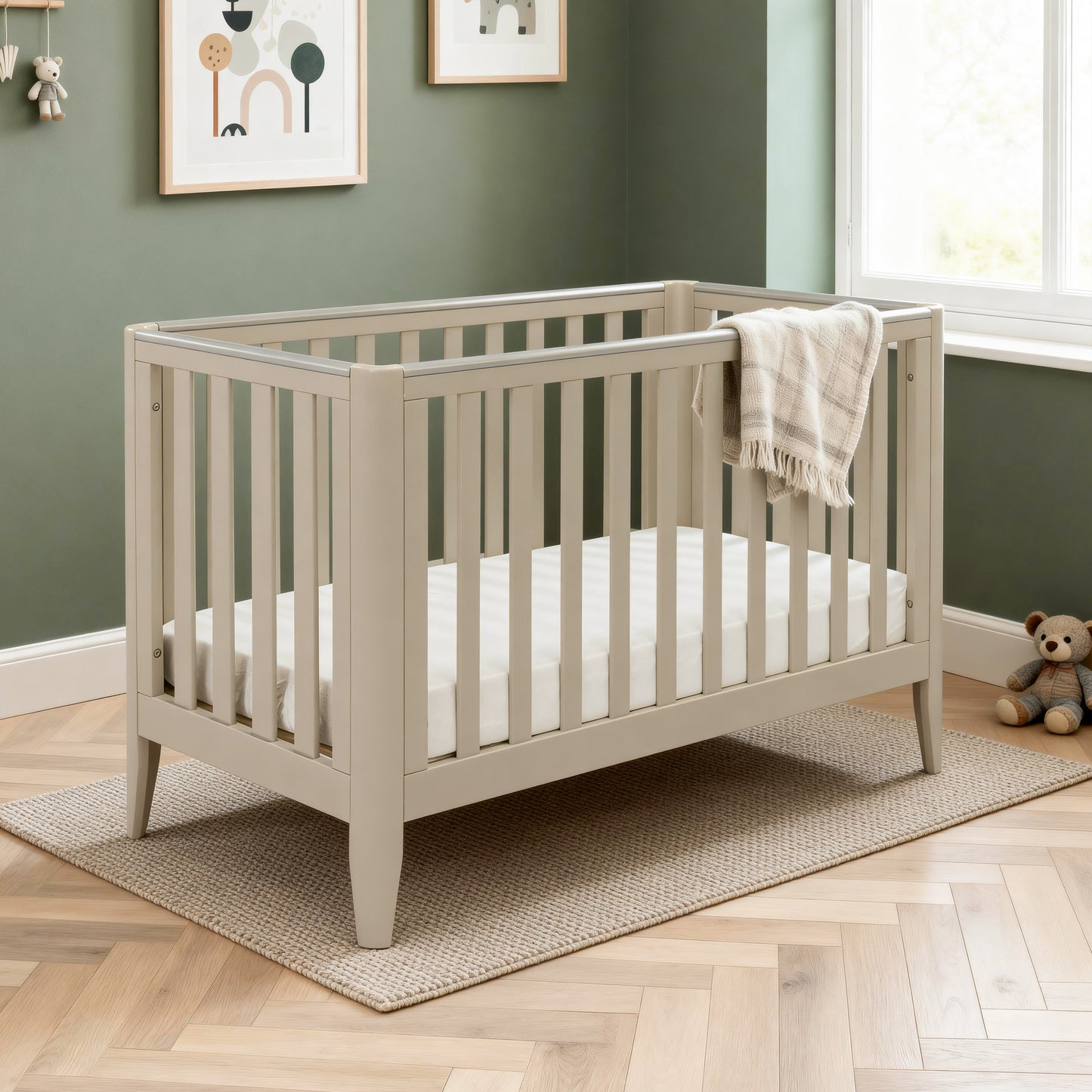 Babymore Iris cot bed cashmere with teething rails in modern nursery bedroom