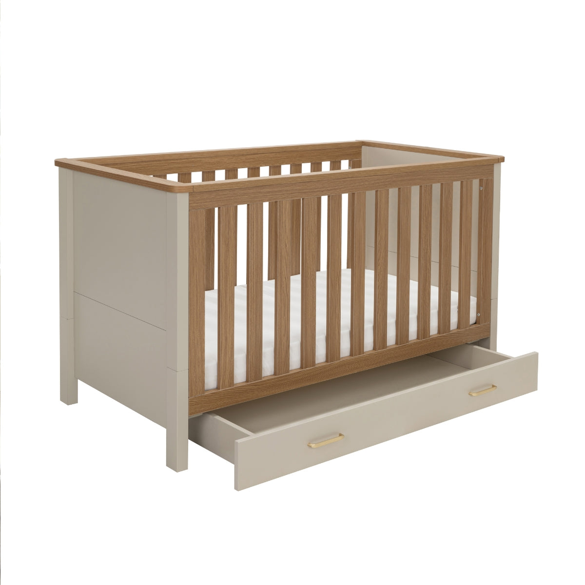 Babymore Mira Cot Bed in Cashmere & Warm Oak with wheeled underbed storage drawer open