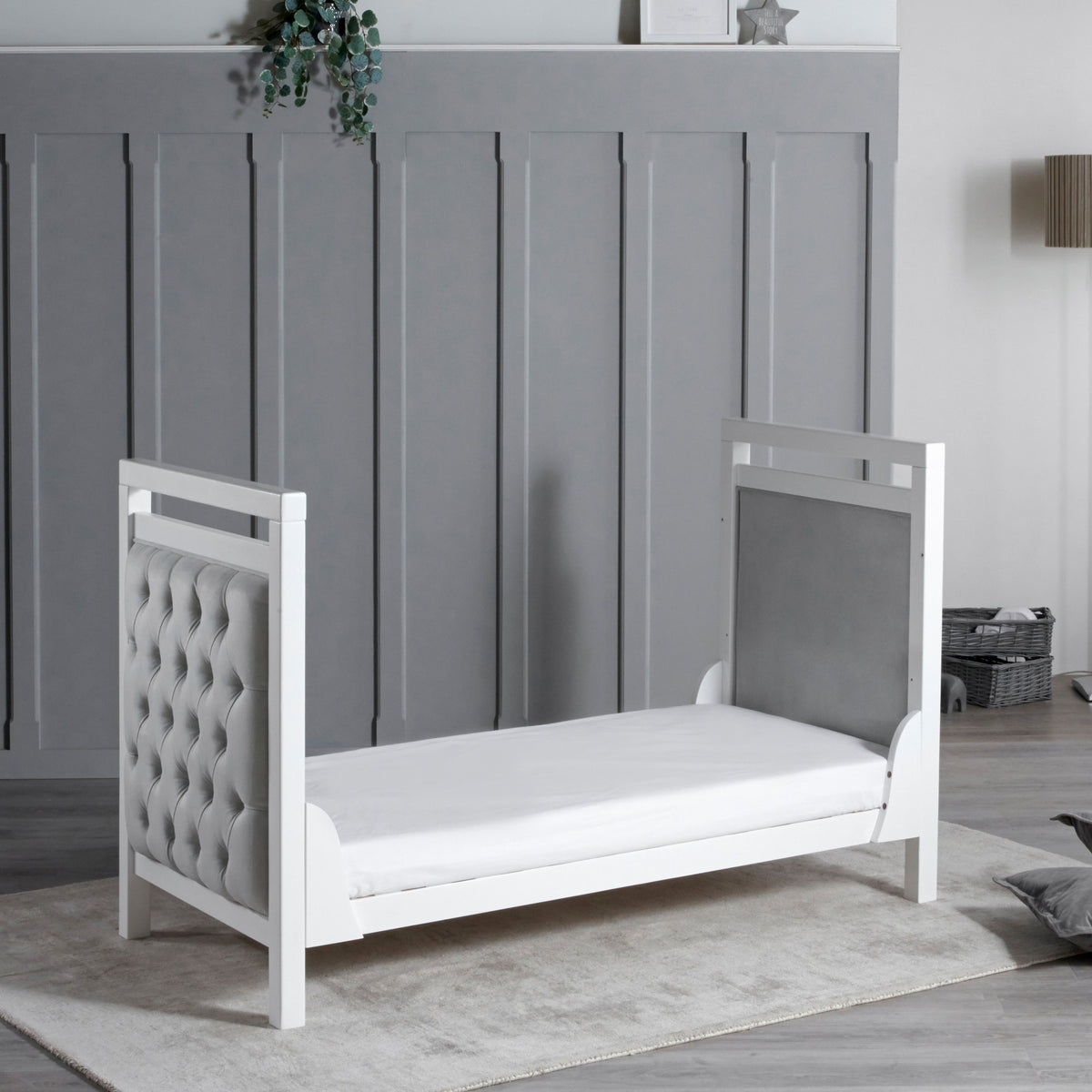 Babymore Velvet Deluxe cot bed converted into toddler bed in nursery