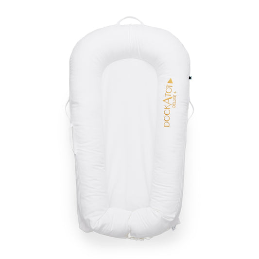 DockATot Deluxe+ Baby Dock Pristine White baby nest on plain white background