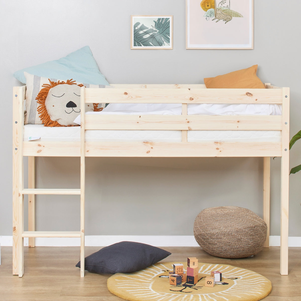 head on view of Hoppekids Eco Comfort mid sleeper bed in natural pine wood with ladder and safety rails for toddlers and children in european scandi style kids bedroom