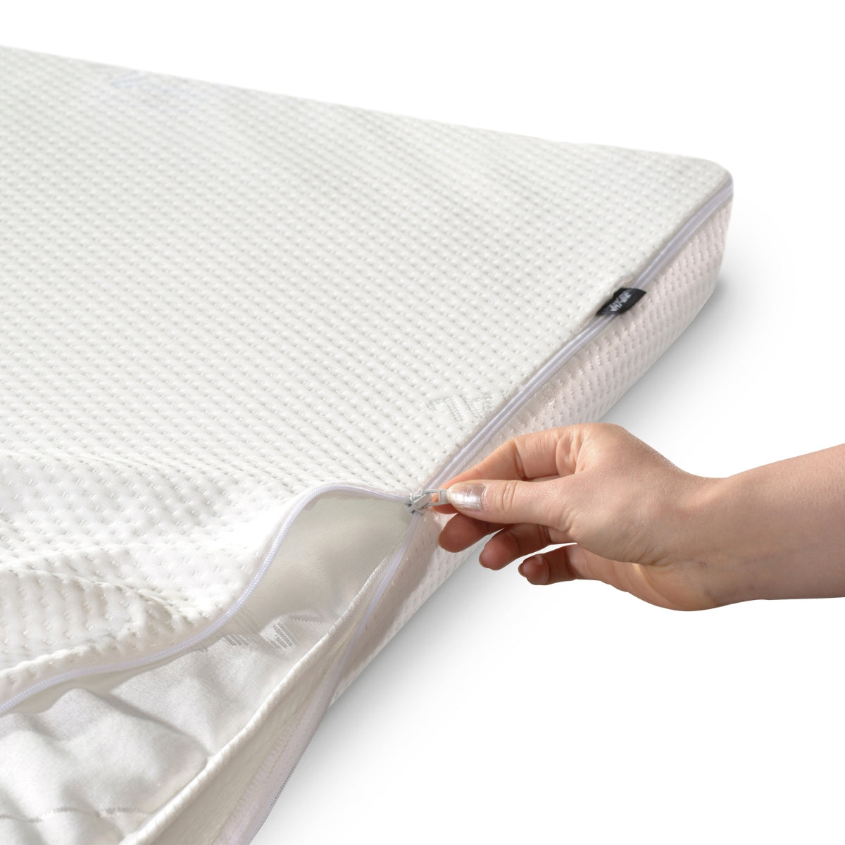 jay-be waterproof washable mattress cover being fitted over folding single bed mattress