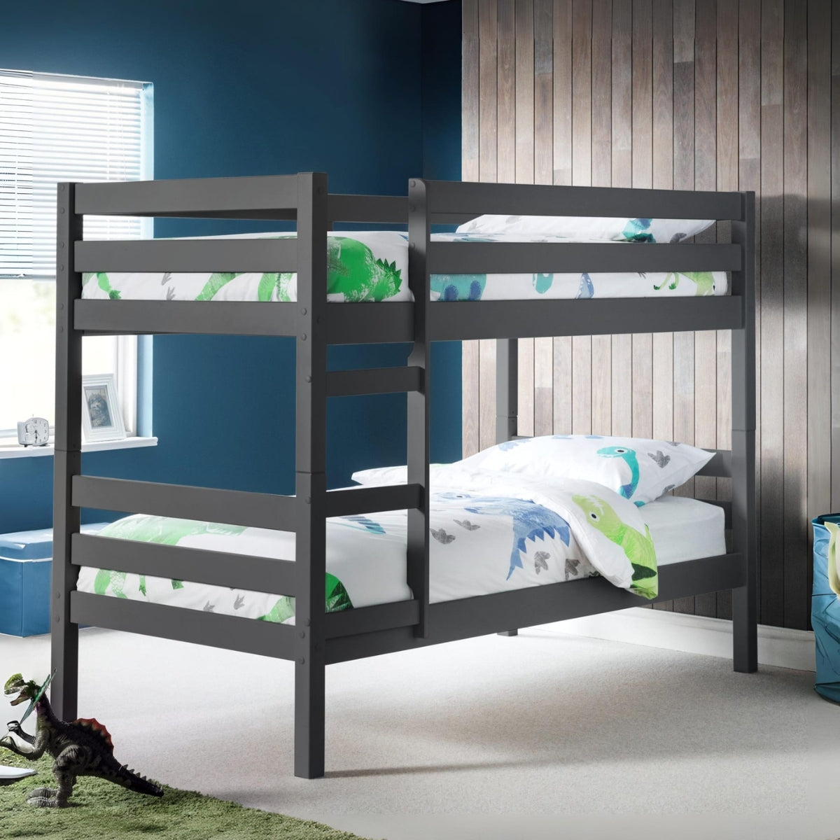 Children's bedroom with a dark wood bunk bed and dinosaur-themed bedding.