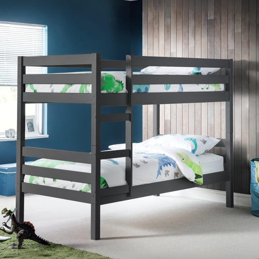Children's bedroom with a dark wood bunk bed and dinosaur-themed bedding.