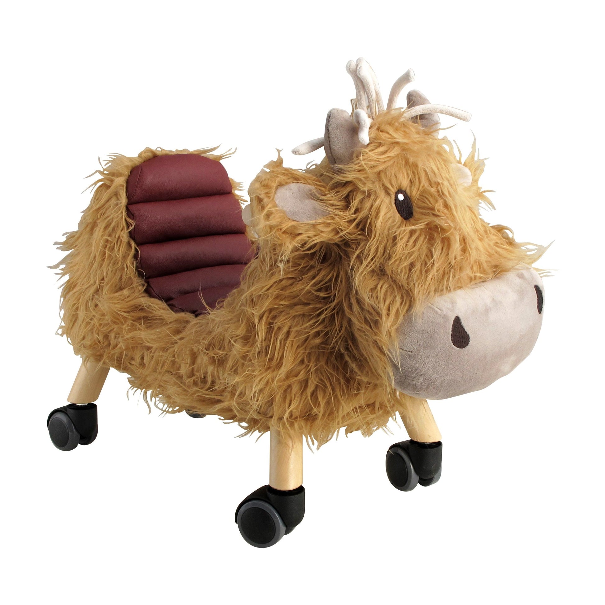 Little Bird Told Me Hubert Highland Cow toddler ride on toy with padded leatherette seat and thick brown wooly fur with wooden legs and black swivel caster wheels