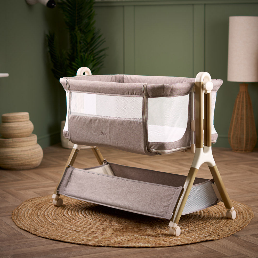 Obaby Cloud bedside crib in Nutmeg with mesh side panels in modern nursery