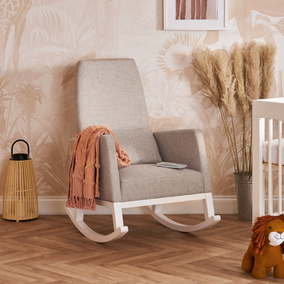 Obaby High Back nursing rocking chair in Silver/Stone next to cot in modern nursery with neutral decor
